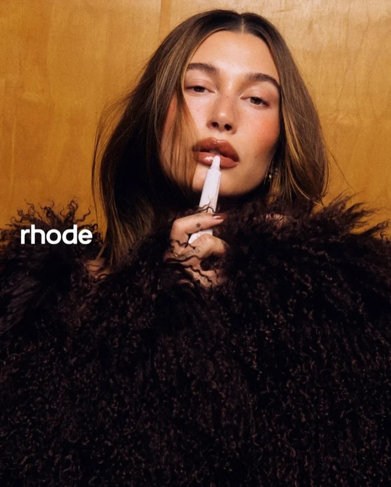 Hailey Bieber poses for Rhode’s Peptide Lip Tint in Cinnamon Roll