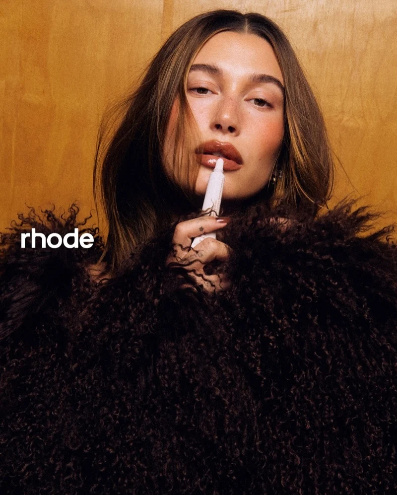 Hailey Bieber poses for Rhode’s Peptide Lip Tint in Cinnamon Roll