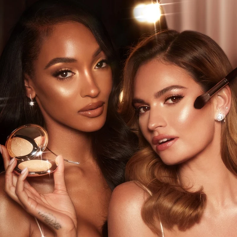 Charlotte Tilbury ambassadors Jourdan Dunn and Lily James front Hollywood Glow Glide Face Architect Highlighter campaign