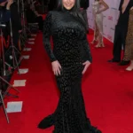 Angela White Keeps It Sleek in a Leopard-Pattern Black Gown in Las Vegas