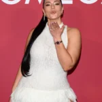 Ashley Graham blowing a kiss at OMEGA House event