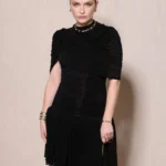 Camille Razat at Paris Fashion Week 2026 BVLGARI ICONS event in black dress