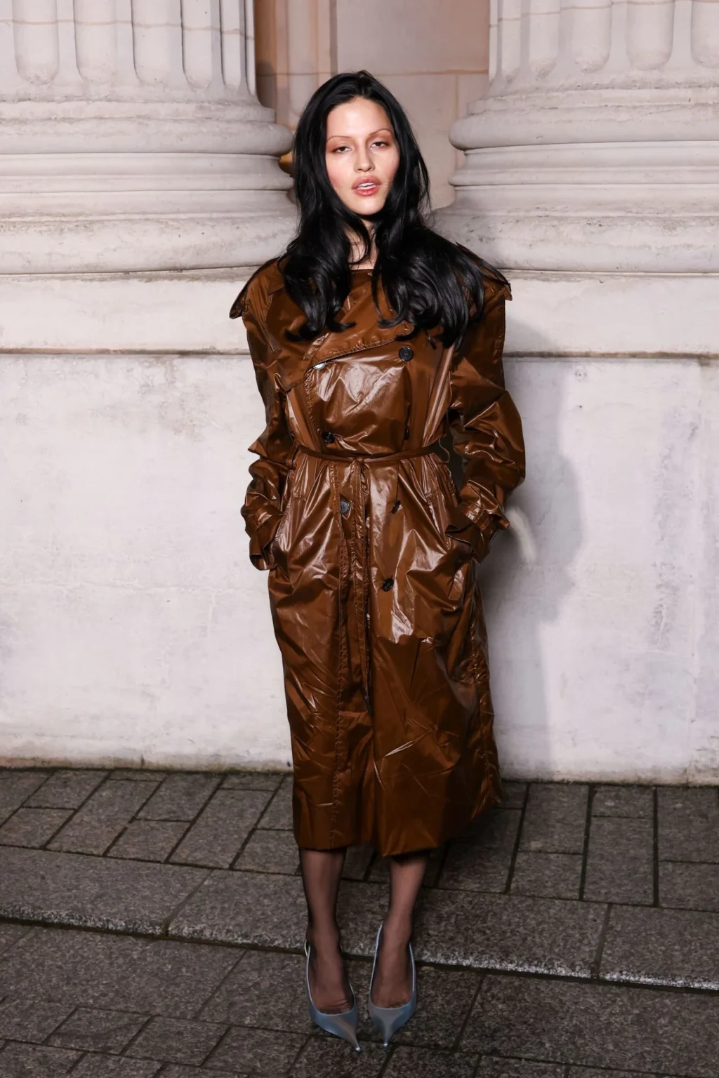 Gabbriette wearing caramel brown trench coat Paris Fashion Week