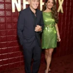 Amal Clooney wearing a green Versace mini dress at the Netflix Golden Globes after party 2026
