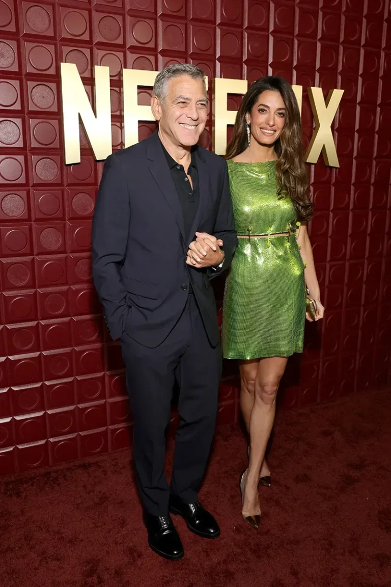 Amal Clooney wearing a green Versace mini dress at the Netflix Golden Globes after party 2026