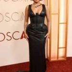 Isabela Merced leather corset gown Oscars 2026 red carpet