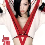 Jennie on the cover of V Magazine wearing a jacket, silk bra, and silk trunks