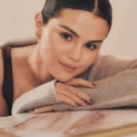 Selena Gomez poses in the Rare Beauty Find Comfort Body Care line