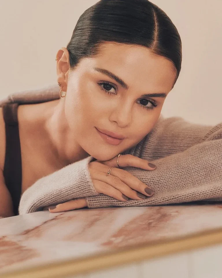 Selena Gomez poses in the Rare Beauty Find Comfort Body Care line