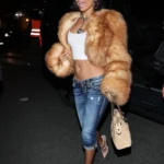 Tyla Y2K street style with fur coat and low-rise denim capris